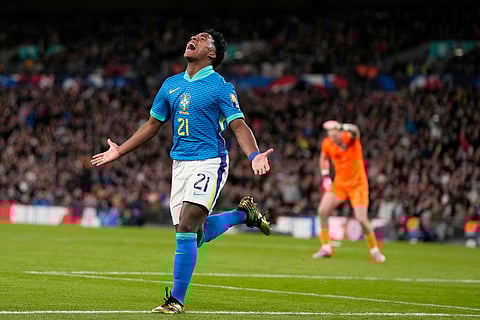 Brazil's Endrick celebrates after scoring the opening goal during a friendly soccer match between England and Brazil at Wembley Stadium in London, Saturday, March 23, 2024. 