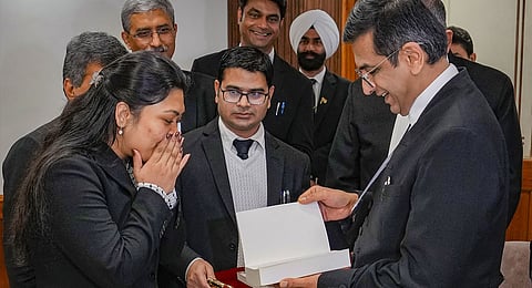 CJI DY Chandrachud felicitates Pragya after she got a scholarship to study masters in law in two different universities in the US, on Wednesday.