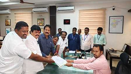 Puthiya Tamilagam chief Dr K Krishnasamy filing his nomination with the Tenkasi returning officer-cum-District Election Officer A K Kamal Kishore