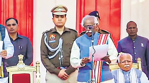 Video grab of Haryana Governor Bandaru Dattatreya (R) administering the oath of office to BJP leader Nayab Singh Saini as chief minister of Haryana, on Tuesday.