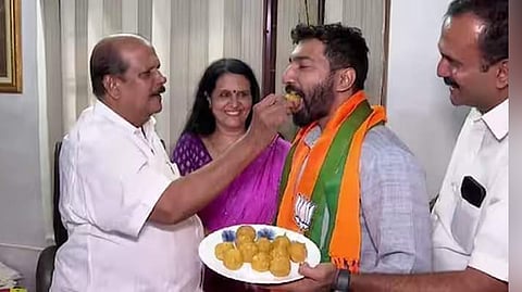 P C George offers sweets to BJP’s Pathanamthitta candidate Anil K Antony at his residence in Poonjar  on Monday.