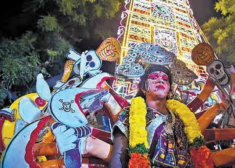 A folk artiste seen taking part in Prabhala Mahotsavam at Yanamalakuduru