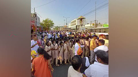 Chidren from an aided school gathered at the Saibaba Colony Junction, awaiting PM Modi's arrival.