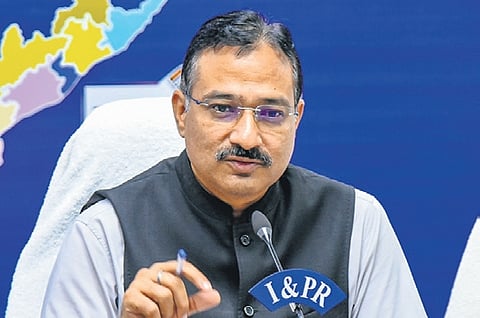 CEO Mukesh Kumar Meena addressing the media at the State Secretariat; a vehicle being checked by police at the Prakasam Barrage in Vijayawada | Prasant Madugula
