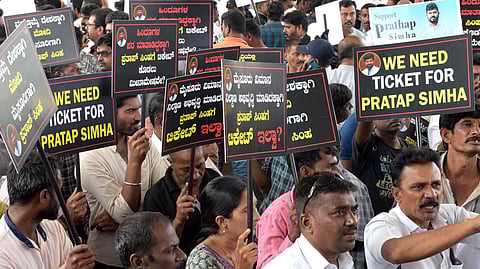 Supporters of Mysuru-Kodagu MP Pratap Simha stage a protest demanding that the BJP give him a ticket, in Mysuru.
