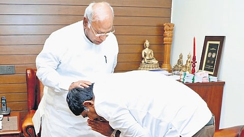 Bengaluru Rural Congress MP DK Suresh seeks the blessings of AICC president Mallikarjun Kharge, in Bengaluru on Tuesday 