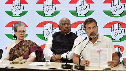 Congress President Mallikarjun Kharge, with party leaders Sonia Gandhi and Rahul Gandhi, briefs the media at AICC headquarters, in New Delhi on Thursday, March 21, 2024.