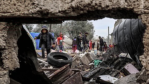Displaced Palestinians inspect the damage to their tents following overnight Israeli bombardment at the Rafah refugee camp in the southern Gaza Strip on March 19, 2024 amid the ongoing conflict in the Palestinian territory between Israel and the militant group Hamas.
