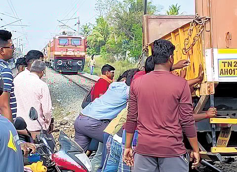 With public and railway workers’ help, the truck was pushed off the tracks, allowing the LC gate to be closed around 9.30 am 