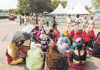 Mission Shakti members staging a protest in front of Naveen Niwas demanding release of salary, in Bhubaneswar on Wednesday