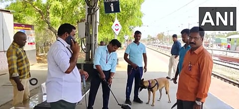 Bomb squad with sniffer dogs search the premises of Palani Railway station. 