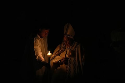 Pope Francis presides over the Easter vigil celebration in St Peter's Basilica at the Vatican, Saturday, March 30, 2024.