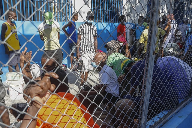 Inmates gather inside the National Penitentiary in Haiti, Sunday, March 3, 2024.