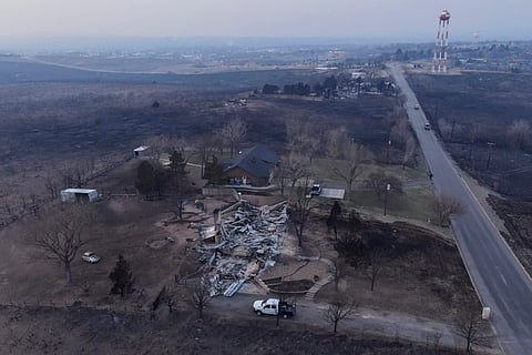 Damage to a property burned by the Smokehouse Creek Fire is seen Wednesday, Feb. 28, 2024, in Canadian, Texas. 
