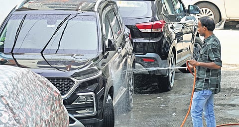 People collect drinking  water from a tanker in  Bengaluru on Monday