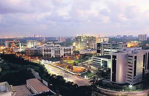 Industries Minister P Rajeeve moves to the podium to address the gathering at the valedictory function of the summit at Lulu International Convention Centre in Kochi on Saturday. T P Sooraj