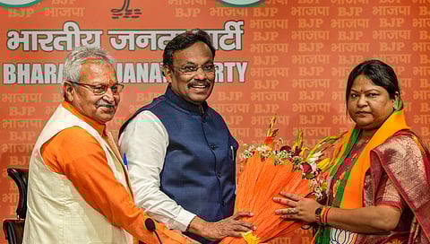 JMM legislator Sita Soren, the sister-in-law of former Jharkhand chief minister Hemant Soren, being felicitated by BJP leaders Vinod Tawde and Laxmikant Bajpai as she joins the party, in New Delhi