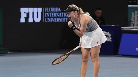 Ekaterina Alexandrova, of Russia, celebrates after beating Iga Swiatek of Poland, during the Miami Open Tennis Tournament, Monday, March 25, 2024.