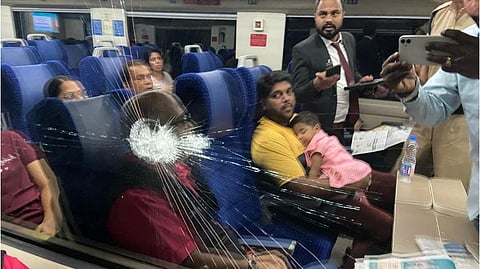 Cracked window of the KSR Bengaluru-Dharwad Express near Chikkabanavar station on Sunday