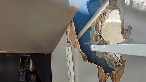 The gang tore down a partition wall and got into the mobile store