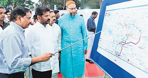 An official briefs Chief Minister A Revanth Reddy and MP Asaduddin Owaisi on the Old City Metro route following the laying of the foundation stone in Hyderabad on Friday 