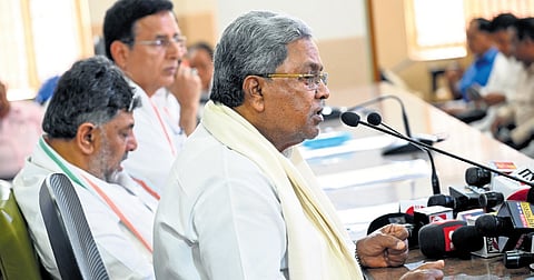 CM Siddaramaiah, DCM DK Shivakumar and Congress Karnataka in-charge Randeep Singh Surjewala at a press conference in Bengaluru on Friday