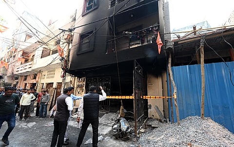 The scorched residential building at Shastri Park area in Shahdara.