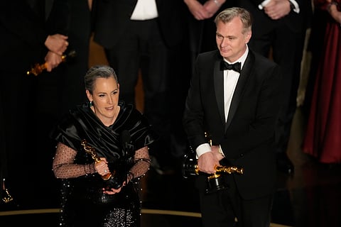 Emma Thomas, left, and Christopher Nolan accept the award for best picture for "Oppenheimer" during the Oscars on Sunday, March 10, 2024, at the Dolby Theatre in Los Angeles. 