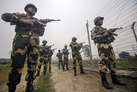 Border Security Force (BSF) patrol near the international border at Hiranagar sector in Jammu. 