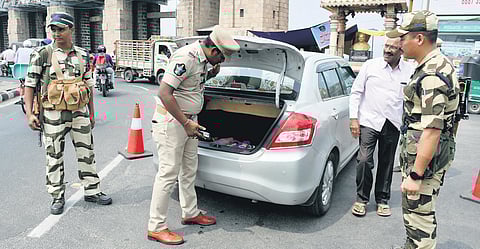 Police along with CISF personnel checking a vehicle at the Prakasam Barrage in Vijayawada on Wednesday I Prasant Madugula