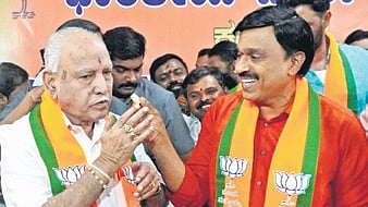 KRPP chief G Janardhana Reddy with BJP leader BS Yediyurappa in Bengaluru on Monday 