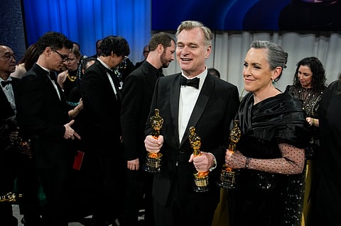 Christopher Nolan, winner of the awards for best director and best picture for "Oppenheimer," left, and Emma Thomas, winner of the award for best picture for "Oppenheimer" pose at the Governors Ball after the Oscars on Sunday, March 10, 2024, at the Dolby Theatre in Los Angeles.