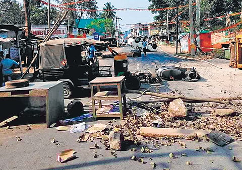 Vehicles vandalised by agitators lying on the road at Chandragiri