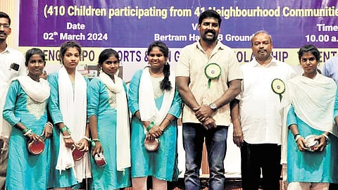 Actor Aruvimathi, Rector Dr Antony Robinson, and Secretary Dr Jeyaraj with the children during the exhibition 