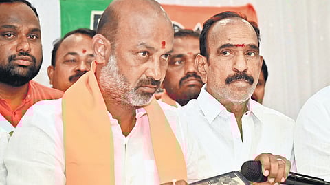 BJP national general secretary and MP Bandi Sanjay Kumar plays a video of former chief minister K Chandrasekhar Rao allegedly using abusive language against him, during a press conference in Karimnagar on Wednesday. Sanjay referred to BRS chief’s claim that he never used abusive language during his 10-year tenure as the chief minister