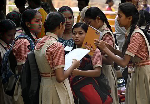 Students arrive to give their SSLC examination at a Government School, one of the centers at Kengeri Satellite Town 