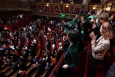 Mps and senators applaud after President of the National Assembly Yael Braun-Pivet announced the result of the vote during the convocation of a congress of both houses of parliament in Versailles, on March 4, 2024, to anchor the right to abortion in the country's constitution. 