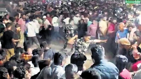 Police personnel attempt to clear the crowd in Moosar-ambagh on Tuesday.