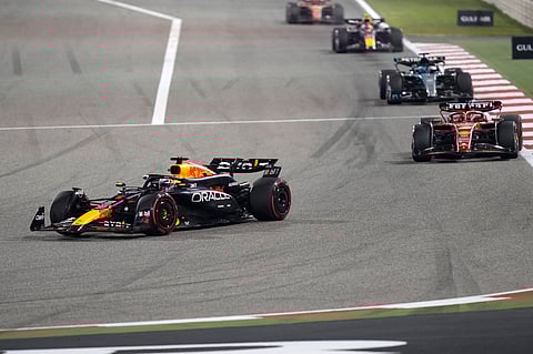 Red Bull driver Max Verstappen of the Netherlands, left, steers his car into a corner at the start of the Formula One Bahrain Grand Prix (Photo | AP)