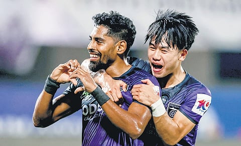 Odisha’s Roy Krishna (L) celebrates after scoring against Mohun Bagan 