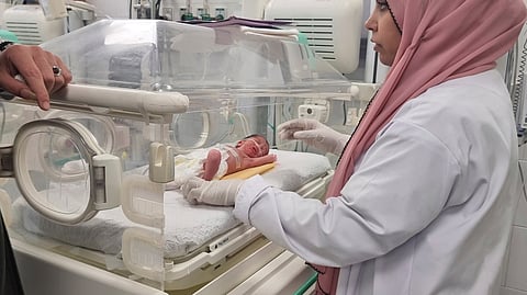 A Palestinian baby girl, Sabreen Jouda, who was delivered prematurely after her mother was killed in an Israeli strike along with her husband and daughter, lies in an incubator in the Emirati hospital in Rafah, southern Gaza Strip. Sunday, April 21, 2024.