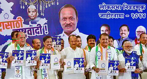 Nationalist Congress Party (NCP) leaders Ajit Pawar and Praful Patel release party’s manifesto for Lok Sabha elections, in Mumbai, Monday, April 22, 2024. 