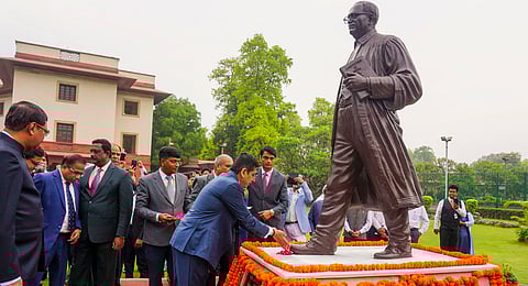 Chief Justice of India DY Chandrachud pays tribute to BR Ambedkar, the architect of the country's Constitution, on his birth anniversary, at the Supreme Court, in New Delhi, Sunday, April 14, 2024.
