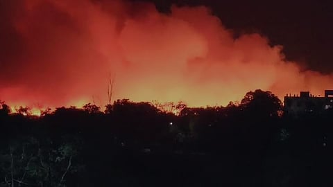 Smoke arising from the Vellalore dumpyard. 