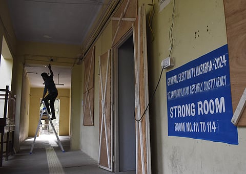 A worker fixing a CCTV cameras near an EVM strong room at Government College of Technology in Coimbatore