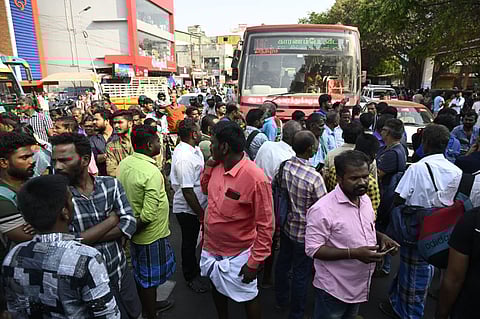 A large number of passengers staged a protest in front of the Singanallur bus stand demanding bus services to Madurai and Theni districts on Friday morning. 