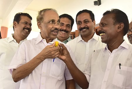 In this April 2024 photo MLA K Babu is seen sharing a lighter moment with Congress workers at his residence in Thripunithura after a court verdict in his favour.