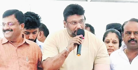Actor Darshan and MLA PM Narendra Swamy at a roadshow for Congress candidate Star Chandru in Mandya district on Thursday