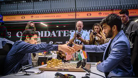  Grandmaster D. Gukesh of India and Grandmaster Hikaru Nakamura of USA during their Round 14 match at the FIDE Candidates 2024 chess tournament, in Toronto, Canada.