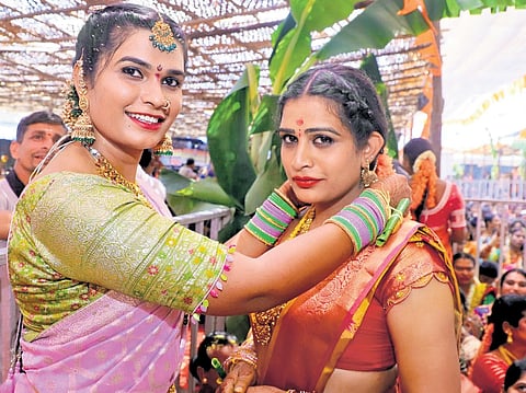 Transgender devotees, dressed as brides, tie the knot to symbolically marry Lord Shiva, as part of a centuries-old ritual, at 
the Sri Swamy temple in Vemulawada on Wednesday